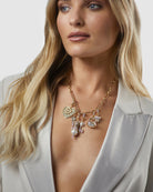 Kitte Artemis Charm Gold attached to Kitte Heirloom Necklace Gold Worn By Model